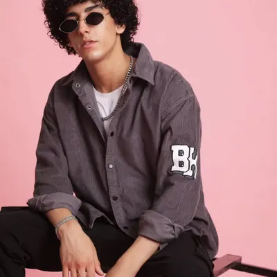 For the 'Chic Street' collection, I focused on creating a cool, urban look for men. This corduroy shirt paired with dark trousers and classic shades is a perfect example of effortless street style.