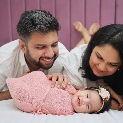 The pure joy of new parents admiring their baby. I focus on creating a relaxed space where these beautiful, unscripted moments can happen. This little one's smile made the whole session.