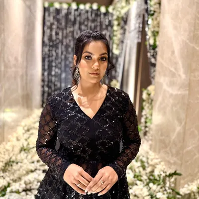 For an evening celebration, I chose this stunning all-black peplum top and sharara pants set. The intricate sequin work adds a touch of glamour, perfect for a cocktail party or reception.