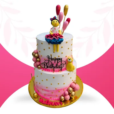 This is a 10-pound, two-tier Rasmalai flavor cake designed for a grand birthday celebration. The intricate design includes a doll topper, fondant balloons, and personalized nameplate, showcasing my ability to handle large, detailed orders.