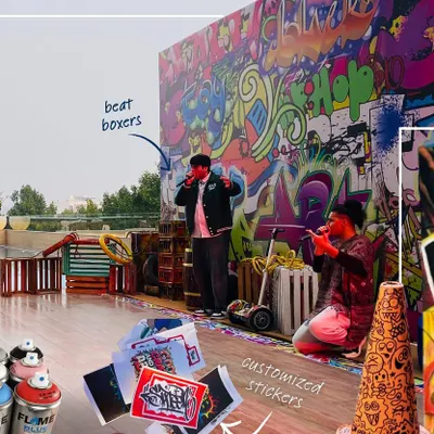 For the Hilton Hotel's GM Conference, we built an entire experience around live art. This shot captures the large-scale graffiti backdrop, the beatboxers performing, and the overall energetic atmosphere we created for the event.