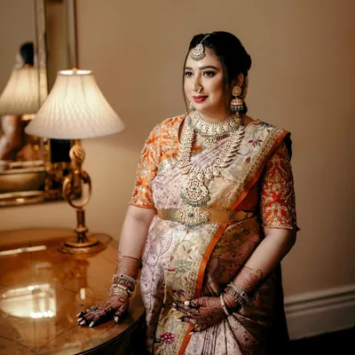 A serene and classic portrait of a glowing mom-to-be at her baby shower. The makeup was kept soft and luminous to complement her traditional attire and the joyous occasion.