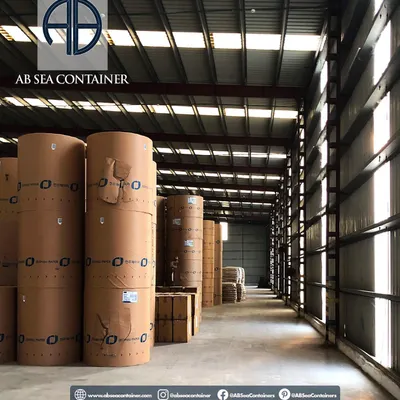 An interior view of my warehousing service, where large paper rolls are stored safely. I offer top-tier facilities designed to protect valuable and sensitive goods from environmental factors.