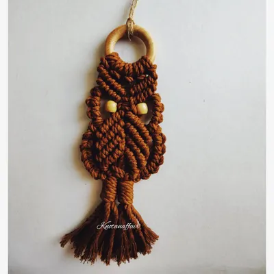 This versatile macrame owl in a lovely brown can be used as a small wall hanging, a bag tag, or even a keychain. It's a perfect boho gift, made with eco-friendly cotton cords and customizable in your choice of colors.