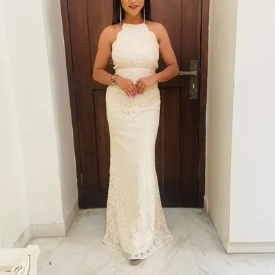 My collection also includes elegant Western wear like this white lace halter-neck gown. It's a sophisticated choice for cocktail events, formal dinners, or even a modern pre-wedding shoot.