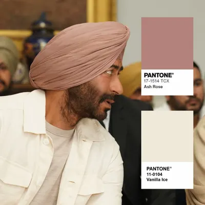 Color is a powerful tool in menswear. For this look, we paired an 'Ash Rose' Pantone turban with a 'Vanilla Ice' jacket. This unconventional combination for menswear was intentional, creating a soft yet confident style for Jassi's character.