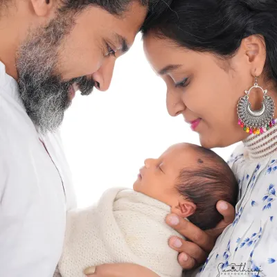 This is the portrait that captures the beginning of your new life as a family. I guide parents into a natural, loving pose that keeps the focus on the connection and the precious new baby in their arms.