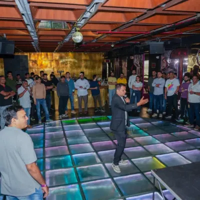 Hosting a corporate party means getting everyone involved. On this light-up dance floor, I'm addressing the team, breaking the ice, and creating a fun, celebratory atmosphere for the evening.
