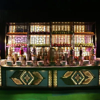 This is one of my elaborate buffet setups, designed to be as visually appealing as it is delicious. The station features intricate backlighting, multi-level displays for various dishes, and elegant serveware, making the food a central part of the decor.