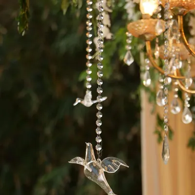 It's all in the details. These delicate crystal birds hanging from beaded strings were part of a larger floral installation, adding a touch of whimsy and sparkle that catches the light and the eye.
