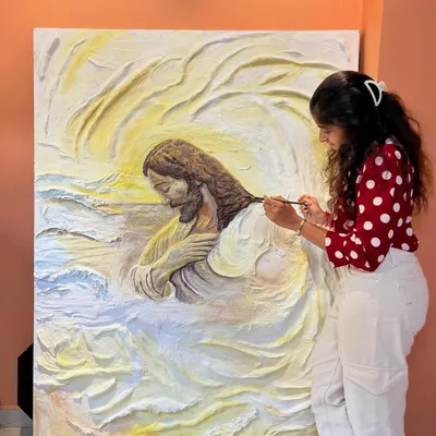 This is a close-up of my massive textured relief painting of Jesus. I spent over 50 hours meticulously sculpting and painting to capture a sense of peace and devotion. The physical effort of working with over 16 kgs of texture paste is a huge part of my process.