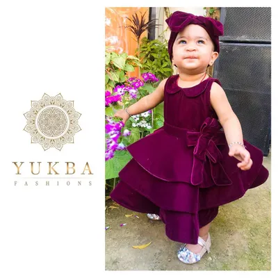 Capturing a moment of pure delight in our custom velvet party dress. The design is perfect for birthdays and special events, combining a comfortable fit with elegant details like the tiered skirt and a matching bow, ensuring your child is the star of the show.