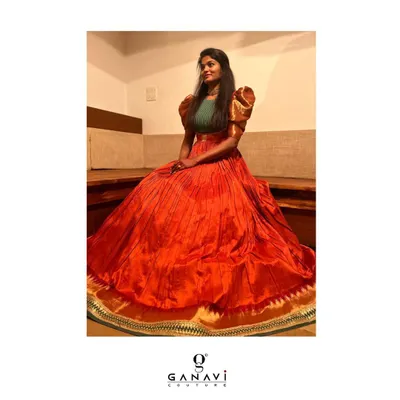 This is a perfect example of textile play and fine construction. I transformed a client's mother's old saree into this beautiful orange gown with statement puff sleeves, creating a new family heirloom.