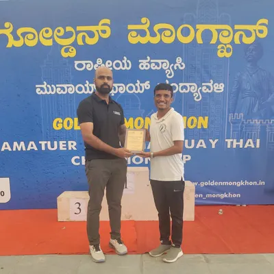 A moment of recognition for our school and coaches at the Golden Mongkhon Muay Thai Championship. Coach Vinod is seen here receiving a memento for his outstanding contribution in mentoring our fighters for the national event.