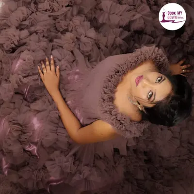 This dramatic top-down view highlights the incredible texture and volume of one of my most popular ruffle gowns. It's a perfect choice for pre-wedding or fashion photoshoots where you want to make a bold statement. My complete service ensures your makeup and hair complement the drama of the dress.