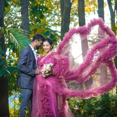 This outdoor maternity shoot in the woods with a stunning ruffled gown created a truly magical, fairytale moment for the expecting couple.