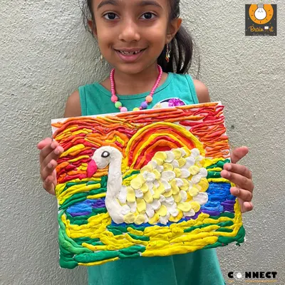 This vibrant swan was made entirely with playdough. Our sensory art classes for ages 3.5 to 5 focus on the process, allowing kids to squish, roll, and shape materials to build hand-eye coordination and self-expression.