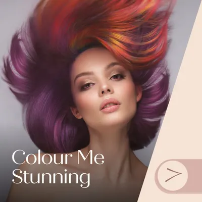 Let your hair be your canvas. This image showcases a vibrant and artistic multi-tonal look, blending shades of red, orange, and purple for a truly unique and eye-catching style. Let us help you express your personality through color.