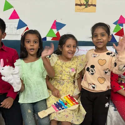 A happy group of campers showing off their handmade puppets and enjoying some music. Puppet making is a wonderful activity that leads to imaginative play and performance.