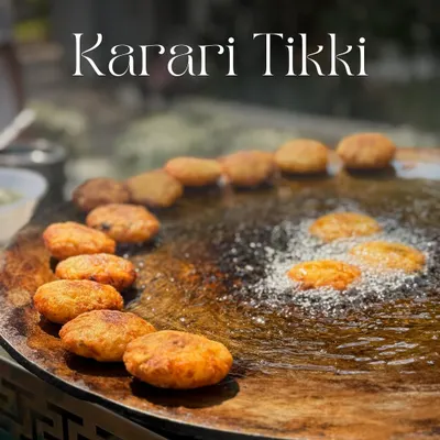 The heart of a great chaat is the tikki. Here are my Karari Aloo Tikkis sizzling on a large tawa, getting perfectly crisp and golden brown before being transformed into a delicious chaat.