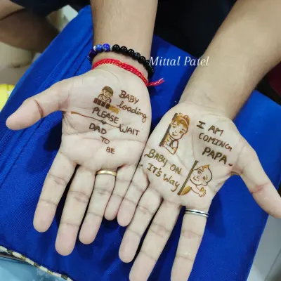 A perfect example of my mehndi for dads to be. These fun, minimalist designs include cute messages and doodles to make him feel part of the celebration.