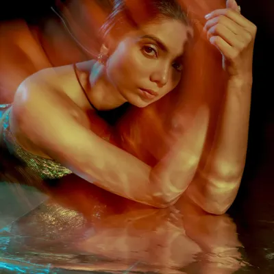 Another take from my long exposure series. I love how the motion blur creates a painterly effect, wrapping the model in warm, glowing light. This is perfect for an artistic or editorial shoot.
