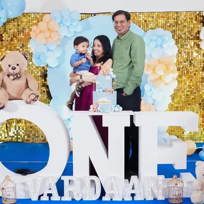 A picture-perfect family portrait for a first birthday. We guide you into comfortable poses that look natural and full of love.