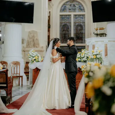 A sacred moment at the altar. We capture the grandeur of the church and the intimacy of the vows in our Christian wedding photography.