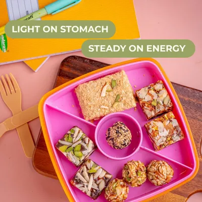 Tiffin time snacks that are light on the stomach and provide steady energy. This lunchbox is filled with my mom-approved sweets and barfis, keeping kids active and focused.
