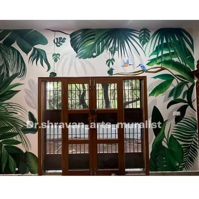 A beautiful tropical mural designed around a French door. The layers of leaves in different shades of green create a sense of depth, making it feel like you're looking out into a real jungle.
