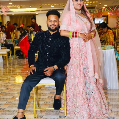A lovely couple at their wedding function. The bride is wearing a beautiful pink and silver lehenga from my rental collection, paired with a simple choker and traditional red and white bangles.