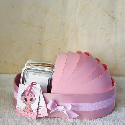 Announce your new arrival with this adorable pink bassinet-shaped hamper. It's a sweet and creative way to share your joy with friends and family.