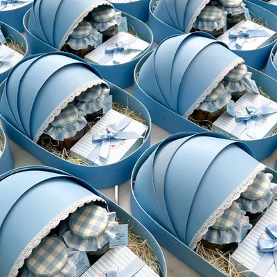 Celebrate the arrival of your little one with our bespoke bulk gifts. These adorable blue cradle boxes are filled with sweet treats to share your happiness and love.