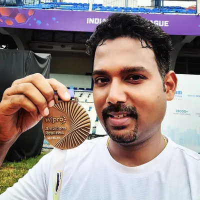 A close up of the prize. This member proudly holding his finisher medal after completing his first full marathon at the Wipro Bengaluru Marathon. A huge achievement made possible through consistent group training.
