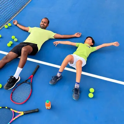 Summer vibes on the court. Taking a moment to relax and soak it all in after a great training session.