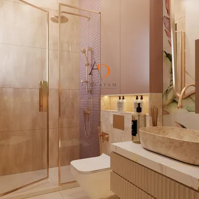 A view of a luxurious bathroom showing the glass shower enclosure with rose gold hardware and the elegant floating vanity.