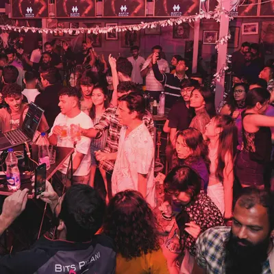 The crowd at Happy Brew is always ready for a party. The energy here is electric, with everyone singing and dancing together.
