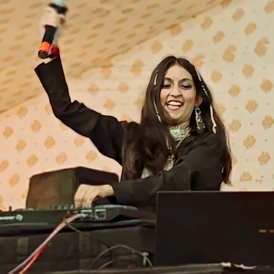 Watch me shine. On stage with the mic in hand, I'm not just playing music, I'm leading the celebration and connecting with every single person in the audience.