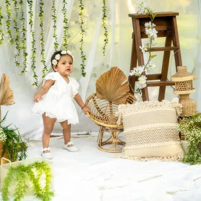 A beautiful outdoor setup for a milestone session. The natural light and greenery create a soft, organic feel that I just love.