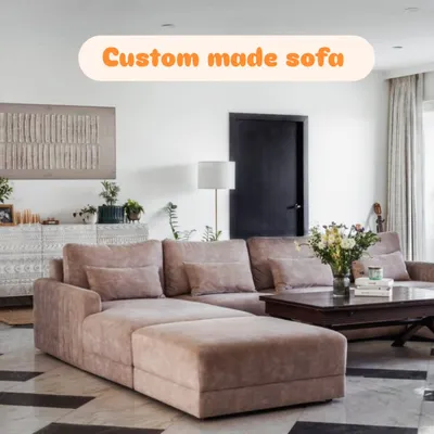 A custom-made L-shaped sectional sofa with a chaise lounge, designed to provide maximum comfort for the whole family. The soft fabric and deep cushions make it perfect for relaxing.