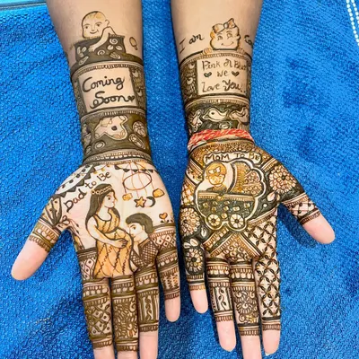 A wonderfully detailed baby shower mehendi. This design includes portraits of the parents, a baby in a cradle, and sweet messages to celebrate the new arrival.