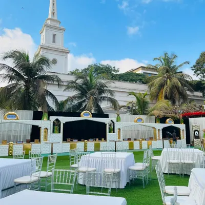 A beautiful daytime setup at a prestigious venue, with my white and gold counters ready for an elegant garden wedding.