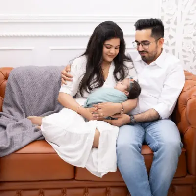 The first family portrait is a memory you will hold dear forever. We capture the pure love and connection as new parents hold their baby, creating a relaxed and intimate lifestyle session right here in our studio.
