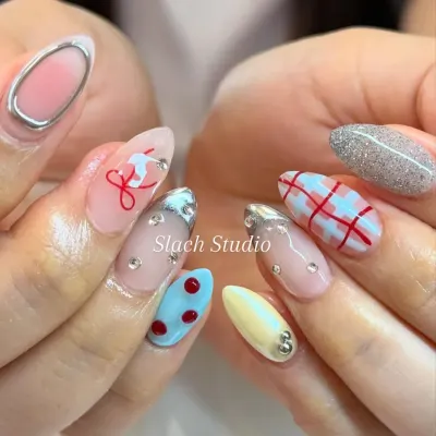 This is my specialty: creating unique, story-telling nail art. This set on almond extensions features a mix of everything, from plaid patterns and 3D chrome to polka dots and glitter. If you can imagine it, I can create it.