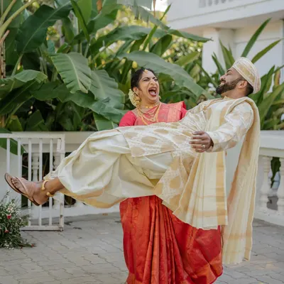 A power couple that knows how to have fun. We love capturing these playful, candid moments that show off your personality, like this bride effortlessly lifting her groom.