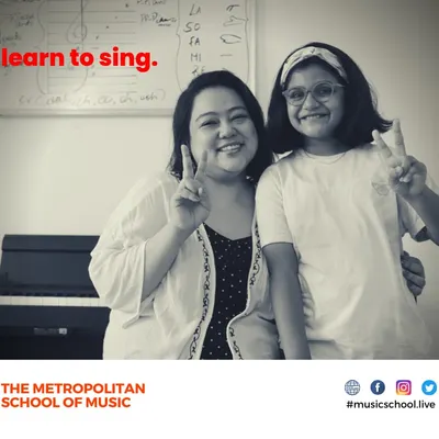 A happy moment between our Western Vocals instructor, Ms. Angelina, and her student. Our teachers are dedicated to making learning to sing an encouraging and rewarding experience.