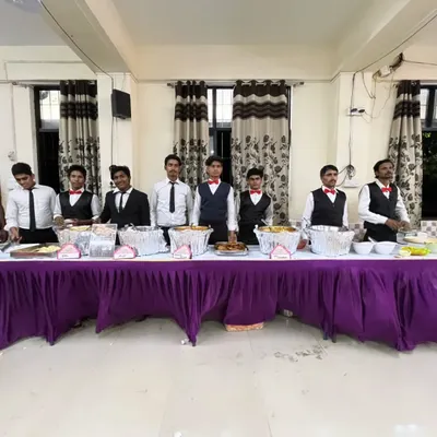 Our full team ready for service. They are trained to handle everything from food arrangement to serving guests, making sure your event is a success.