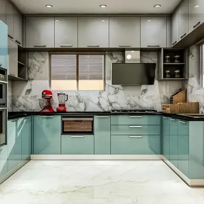 A U-shaped modular kitchen in a striking teal and grey combination. This layout maximizes counter space and storage, featuring a marble-patterned backsplash and integrated appliances for a seamless finish.