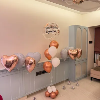 We love creating the perfect birthday aesthetic. This assorted balloon bouquet features rose gold hearts, a personalized "Happy Birthday Queen" bubble balloon, and a soft pastel color palette for a totally chic celebration.