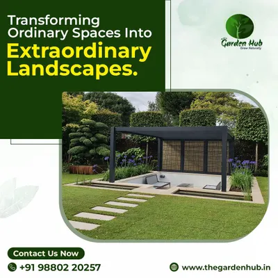 This image showcases a modern, minimalist black pergola set within a manicured landscape. The clean lines and open design create a sophisticated focal point while defining a comfortable outdoor seating area.